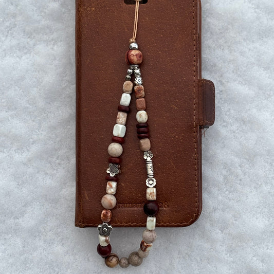 Bijou de portable "Racines Ardentes"